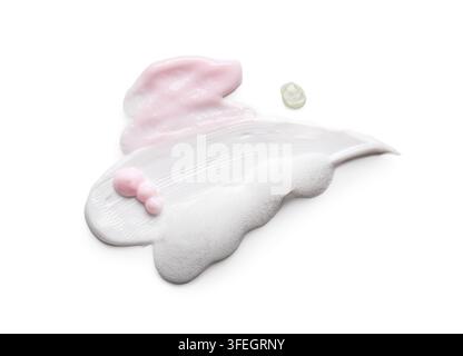 Skincare and beauty routine, cosmetic cream and facial cleanser foam smear with pink lotion texture isolated on a white background Stock Photo