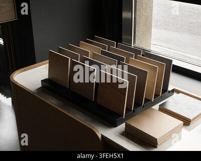 Wood and material samples on display in a modern showroom Stock Photo