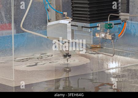 Industrial Water Jet CNC Machine Steel Metal Cutting in Workshop Stock Photo