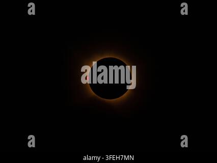 Stunning Sun Chromosphere Red Rim and Massive Flares During Totality Stock Photo