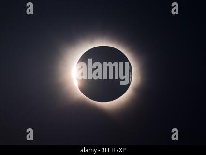 Baily's Beads Shining Around the Moon During Total Solar Eclipse Stock Photo