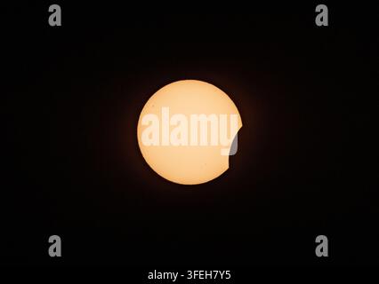 First Contact Phase of Total Solar Eclipse Detailed Telescope Shot Stock Photo