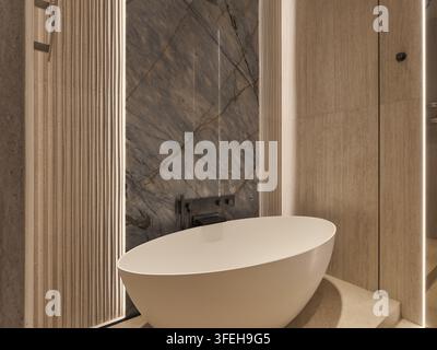 Sleek freestanding tub in a contemporary marble bathroom Stock Photo