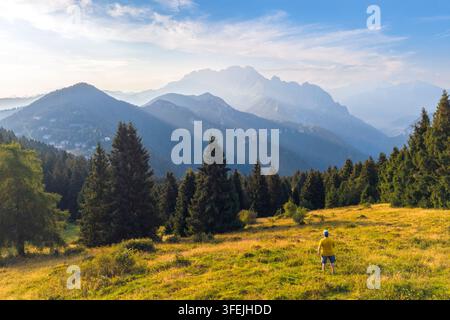 The panoramic view over Presolana massif in summer from Croce del Vareno. Angolo Terme, Valcamonica, Brescia district, Lombardy, Italy. Stock Photo