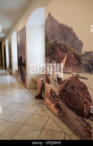 Contemporary art installations and paintings displayed on a long hallway corridor wall inside the Albertina Museum art gallery, Vienna, Austria. Stock Photo