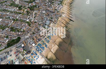 Aerial view of traditional wooden houses nestled on a lush green ...