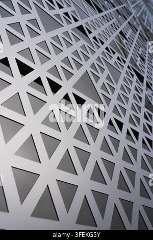 The geometric metal facade of the Q1 building on Handyside Street in London's King's Cross highlights modern architectural design. Stock Photo