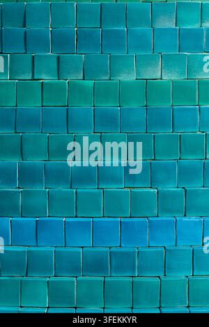 Background of small square tiles in different shades of blue and green close up Stock Photo