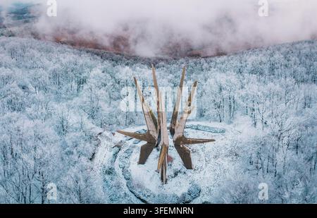 January 3, 2026, Sopot, Serbia: Star-shaped Kosmaj Monument rises above frost-white forest canopy in winter mist Stock Photo