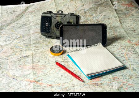 Planning outdoor adventure using map and navigation tools Stock Photo