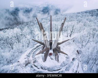 January 3, 2026, Kosmaj, Serbia: Aerial top-down view of the partisan monument encircled by snow-laden forest Stock Photo