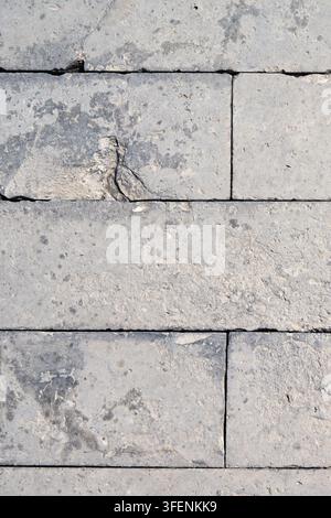 Weathered Gray Limestone Block Wall Texture with Natural Stone Surface Pattern Stock Photo