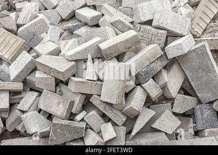 Concrete blocks forming a chaotic pile of building debris and construction waste Stock Photo