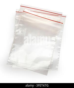 Transparent reclosable plastic bags with red zip closure on white background Stock Photo