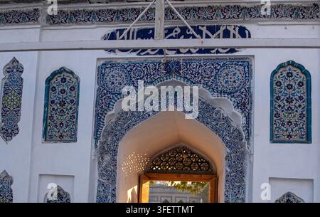 View of the intricate blue and white tile work on the entrance arch of the Shrine of Shah Abdul Latif Bhittai in Bhit Shah, Sindh, Pakistan. Stock Photo