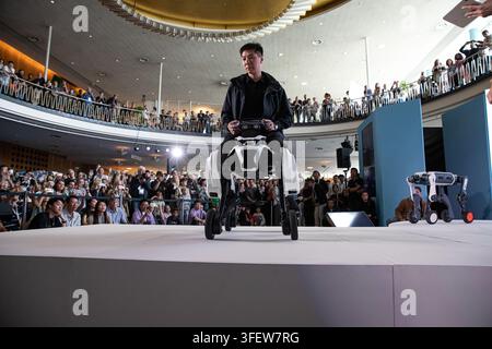 Humanoid robots, quadrupeds and AI-powered companion machines perform during Robots on the Runway at IFA 2026 at Messe Berlin in Berlin, Germany, on Saturday, September 5, 2026. The live technology showcase turned the traditional fashion-show format over to robots, with machines walking the catwalk, dancing, posing, performing tricks and demonstrating advances in movement, sensor technology and human-machine interaction. Eleven robotics companies took part in the show, bringing together humanoid, four-legged, transformable and companion robots as artificial intelligence and so-called embodied Stock Photo