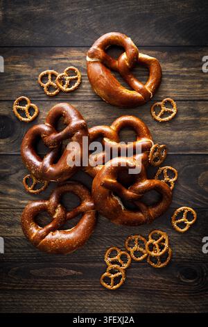 Oktoberfest Pretzel bavarian soft baked brezel and mini snacks on dark wooden background Stock Photo