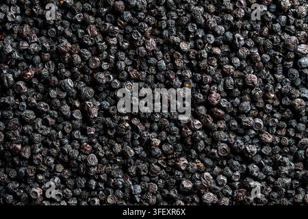 Top view of dense heap of organic dried blueberries, creating natural textured background, close up. Great for healthy nutrition, superfood ingredient Stock Photo