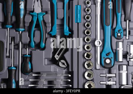 Complete auto repair tool kit with screwdrivers, pliers, ratchets, and sockets in case Stock Photo