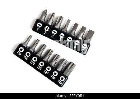 Set screwdriver bits in black holders, showing Torx, Phillips, and flat heads on white background Stock Photo