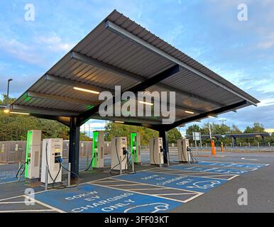 BP Pulse chargers under the solar canopy at York's Monks Cross HyperHub, a council-owned EV charging facility beside Park & Ride. Stock Photo