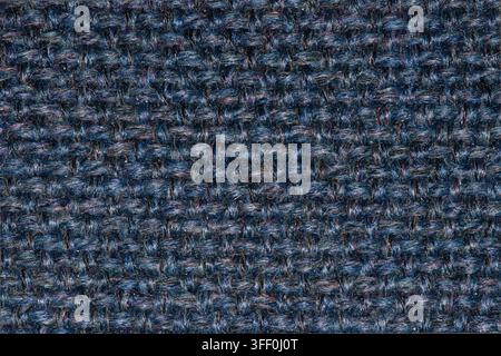 Navy blue wool fabric woven thread color swatch pattern with light colored flecks. Stock Photo