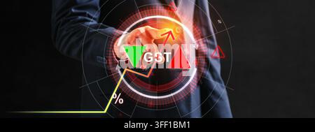 A businessman in a suit interacts with a futuristic digital interface showing GST text, percentage symbols, and upward and downward trend arrows repre Stock Photo