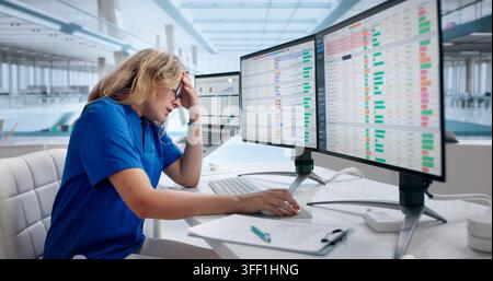 Young Woman Sitting At Laptop, Struggling With Complex Medical Billing Codes. Stock Photo