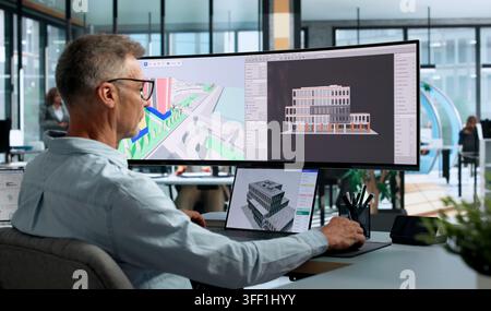 Engineer Studies 3D Building Model On Laptop For Smart Construction Planning. Stock Photo