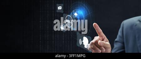 A close-up of a professional person interacting with a futuristic, holographic digital user interface displaying icons for skill development and techn Stock Photo