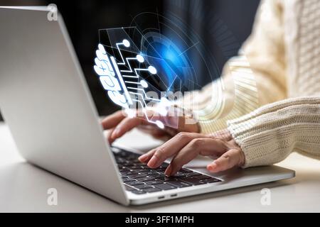 Close up of a person working on a laptop, featuring a glowing holographic neural network interface symbolizing artificial intelligence, data analytics Stock Photo