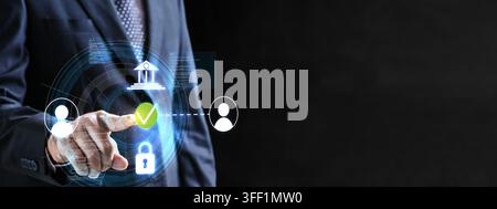 Businessman touching digital screen with secure online banking icons, cyber security, identity verification, and fintech concept on dark background Stock Photo