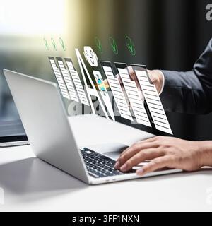 Businessman typing on a laptop with a digital hologram showing AI, smart checklists, and document verification. Concept of Smart Office Automation Stock Photo