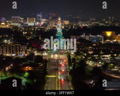 Aerial view of the night city glowing with lights from an airplane ...