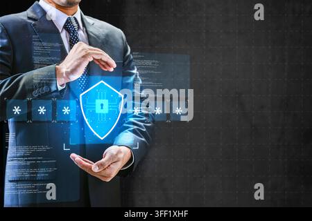 Businessman holding a glowing holographic shield icon with asterisks, representing cybersecurity and password protection. Concept of multi-factor auth Stock Photo
