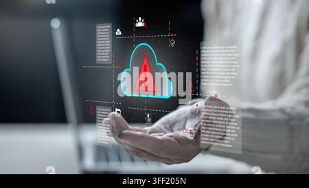 A female holding a holographic glowing cloud icon with a red warning exclamation mark, symbolizing cyber security threats, cloud failure, data breach, Stock Photo