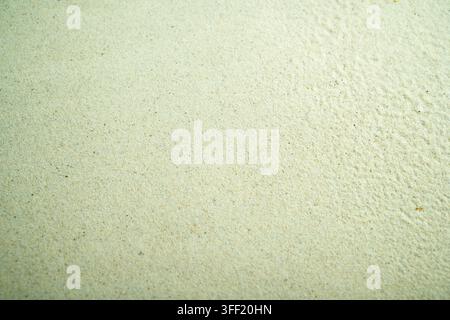Fine light-green textured sandy surface background, suitable for abstract wall plaster or paper designs with copy space. Summer, natural or texture ba Stock Photo