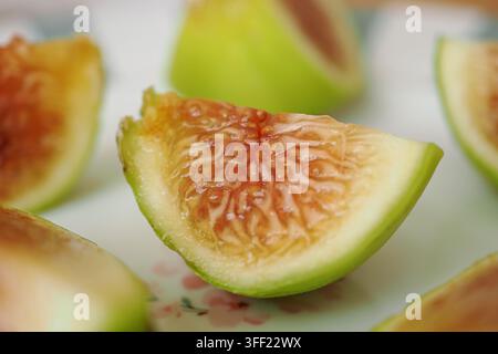 Sliced ripe figs arranged on a plate for serving Stock Photo