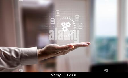 Business person holding a digital hologram of gears and document icons. Concept of cloud computing storage and digital storage technology Stock Photo