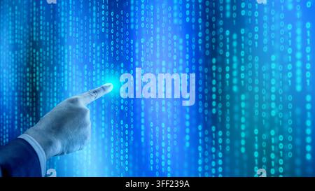 A hand pointing at a glowing blue digital screen filled with binary code, representing cyber security and data analysis. Concept of programming or tec Stock Photo
