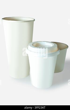 Three white and beige paper coffee cups in various sizes, one with a lid, isolated on a white background. Mockup or Copyspace Stock Photo