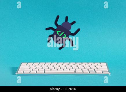 Programming bug icon hovering over a keyboard representing cybersecurity threats and code errors Stock Photo