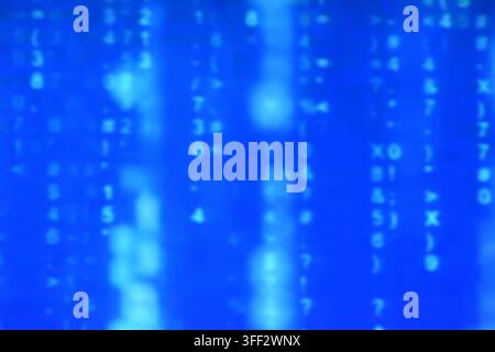 blurry binary number system on blue computer screen background and texture Stock Photo