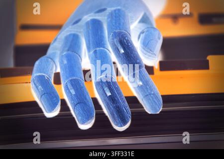 Close-up of a robotic hand searching for a document among a stack of office papers and files, representing artificial intelligence, automated document Stock Photo