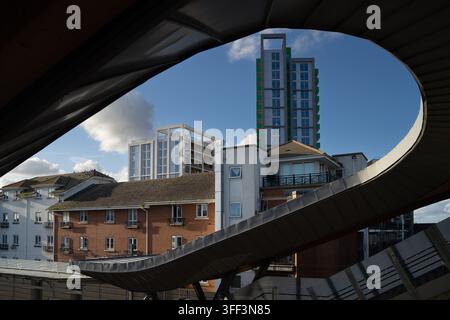 Abbey Wood Station's curved roof frames London's skyline, showcasing the Elizabeth Line hub's modern architectural transformation. Stock Photo