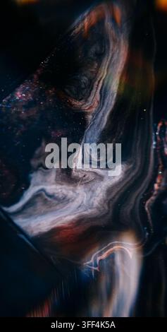 Glitter abstraction. Blur paint wave. Purple blue orange color sparkling pigment mix texture acrylic splash on background. Stock Photo