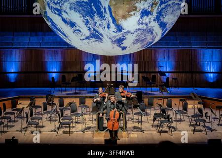 Members of the BBC Concert Orchestra perform in the Royal Festival Hall, underneath GAIA, a massive earth art installation by Luke Jerram. Stock Photo