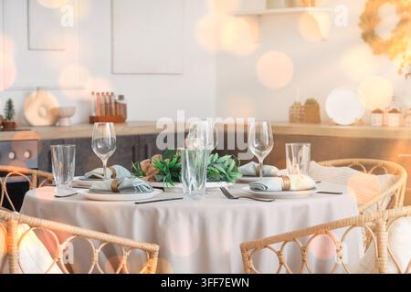 Holiday dinner party preparation, festive home dining table setting with elegant tableware and warm bokeh lights for seasonal celebration and gatherin Stock Photo