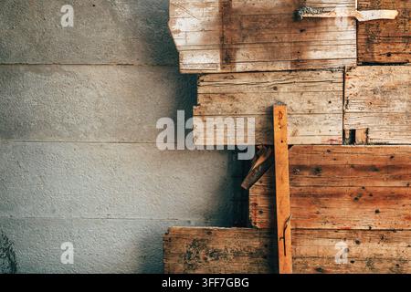 Raw concrete wall texture combined with wooden shuttering panels. Concept of architectural construction, industrial materials, and building developmen Stock Photo