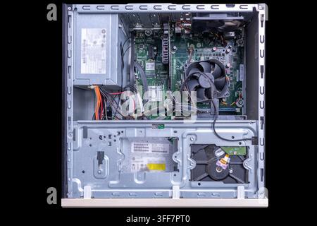 Close up shot of heavy dust buildup on desktop computer CPU fan blades, highlighting the need for hardware maintenance and cleaning to prevent overhea Stock Photo